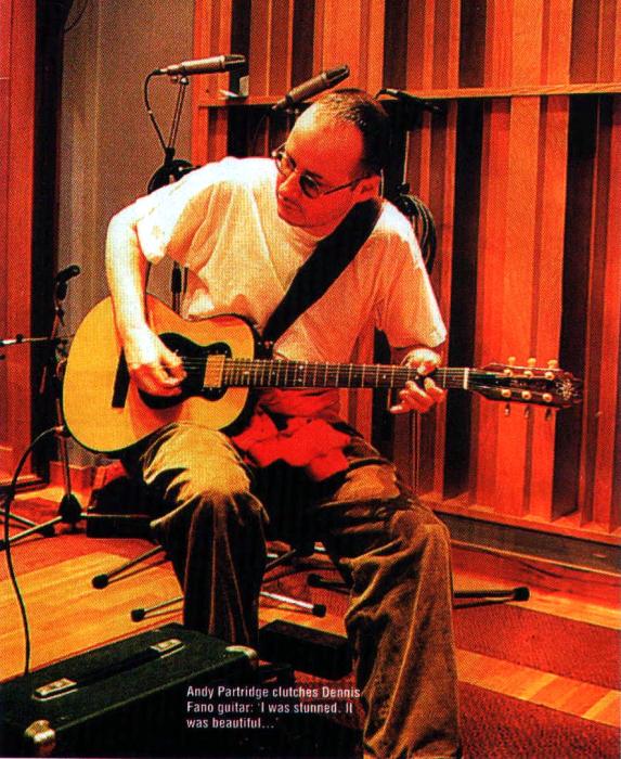 Andy Partridge clutches Dennis Fano guitar